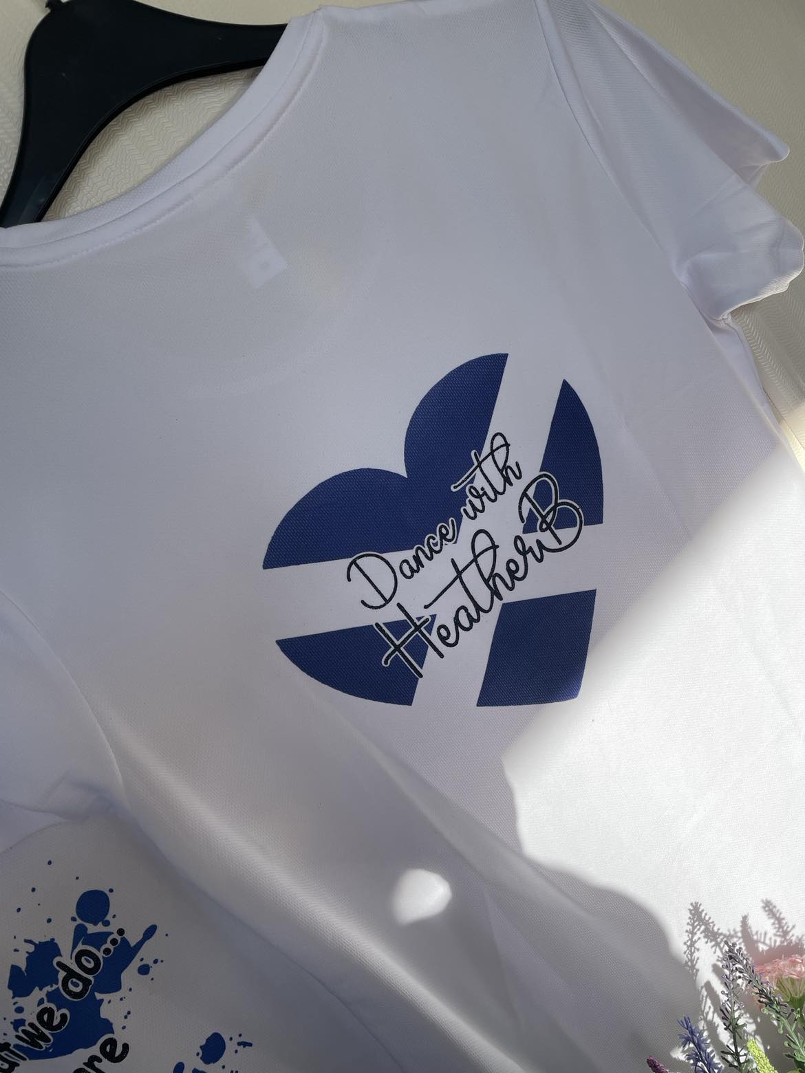a photo of a tshirts with the heart shaped saltire and Dance with Heather B text